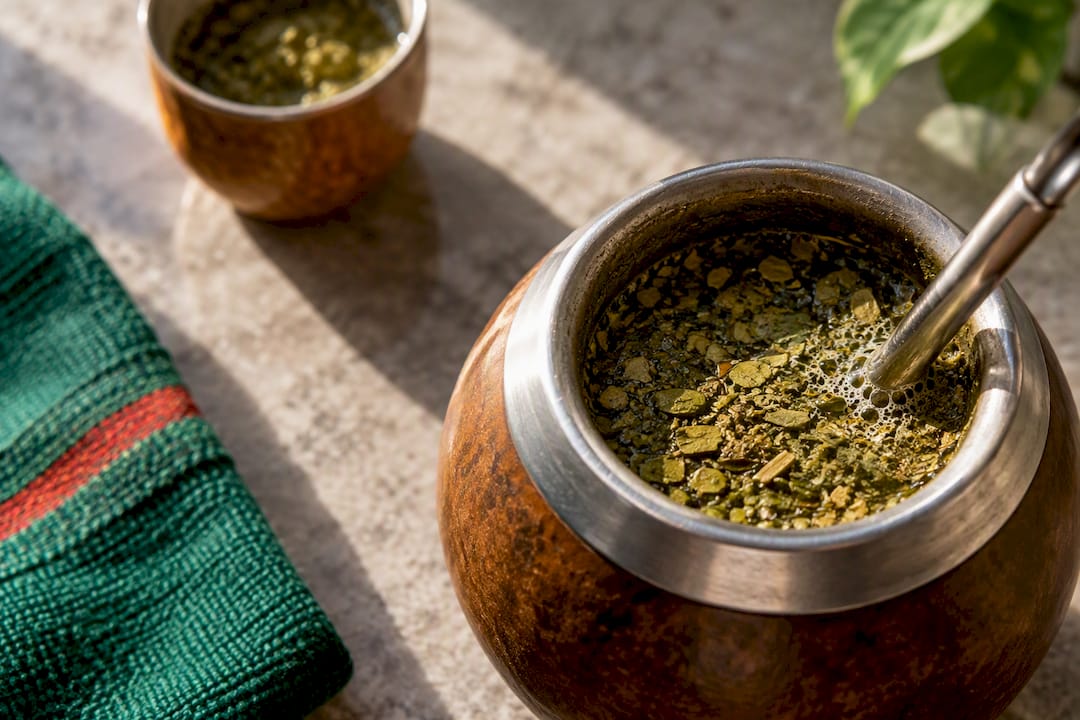 Yerba mate leaves steeping in a gourd