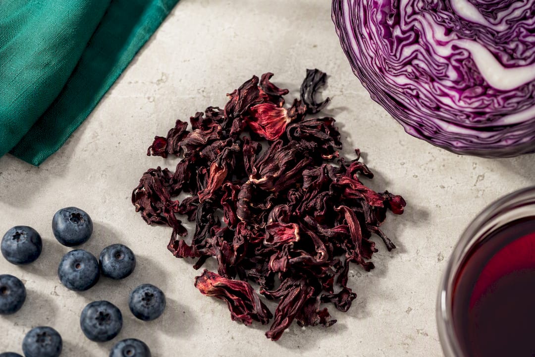 Hibiscus calyces with blueberries and red cabbage